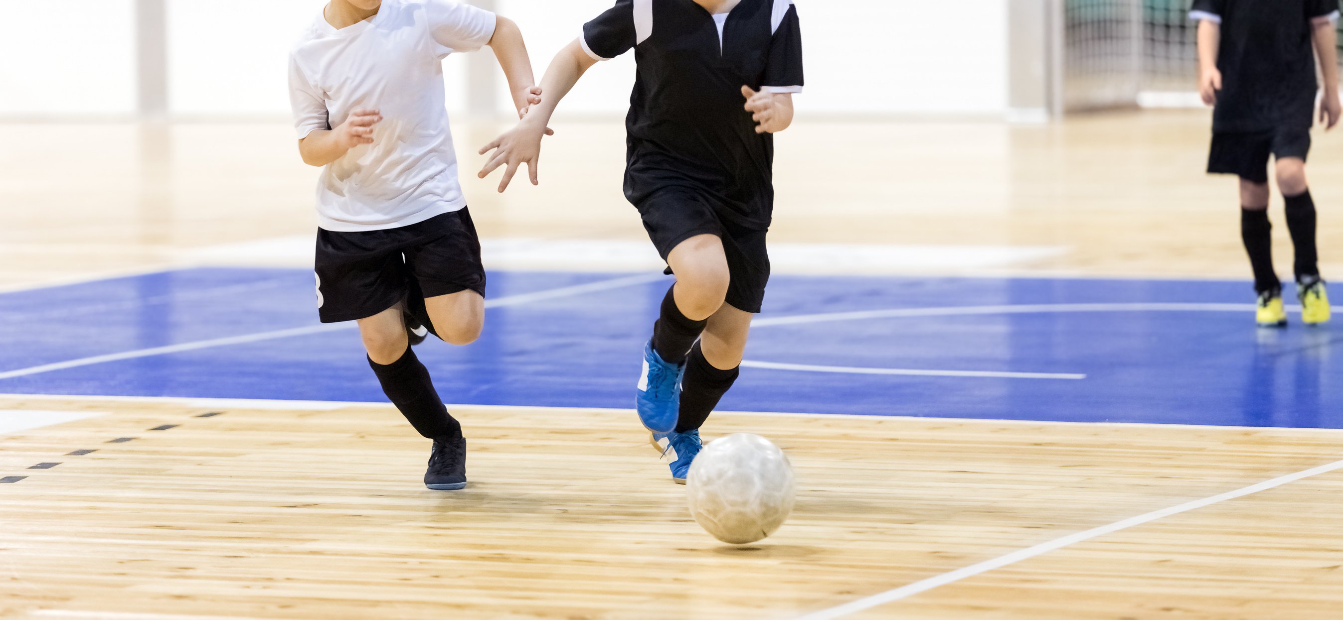 School Boys on Indoor Football Tournament Game. Football Futsal